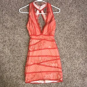 Bebe Orange lace and nude form fitting mini dress